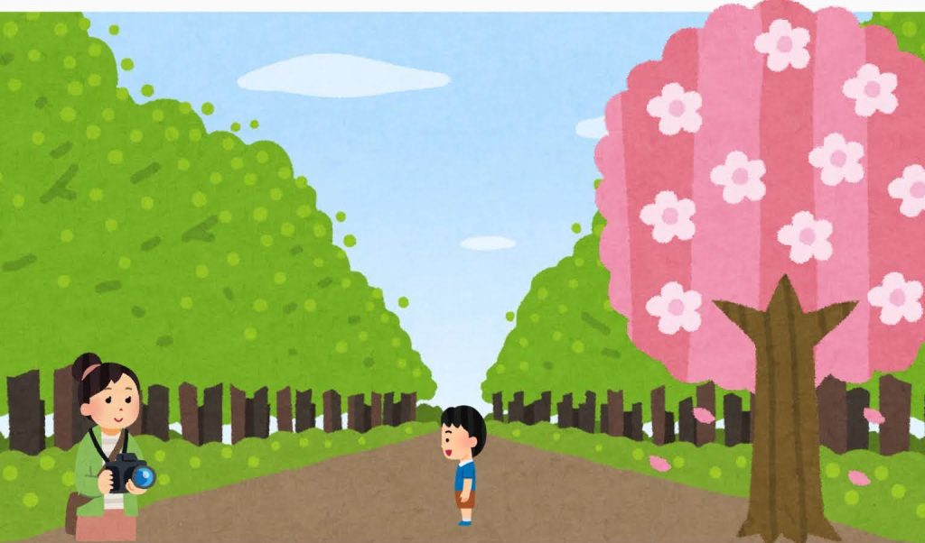 子供を桜の手前に立たせて、しゃがんで撮っている画像